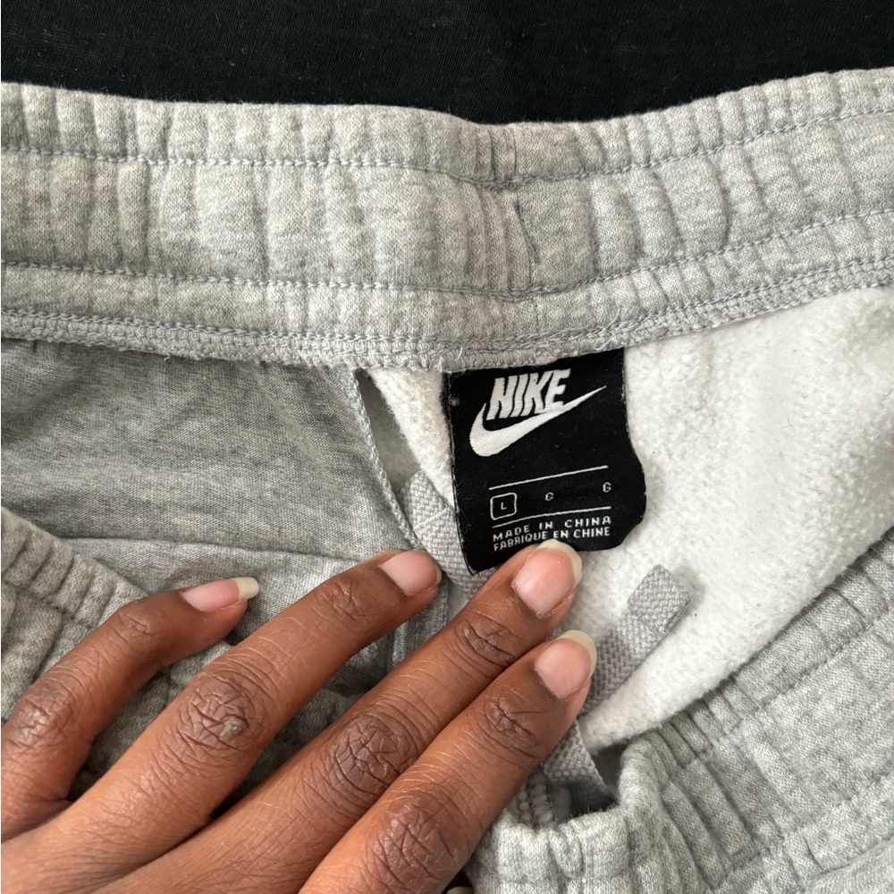 Nike grey sweats size large, drawstring inside and front and back pockets